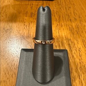 Elegant Goldtone Band with Faux Diamond Accent.